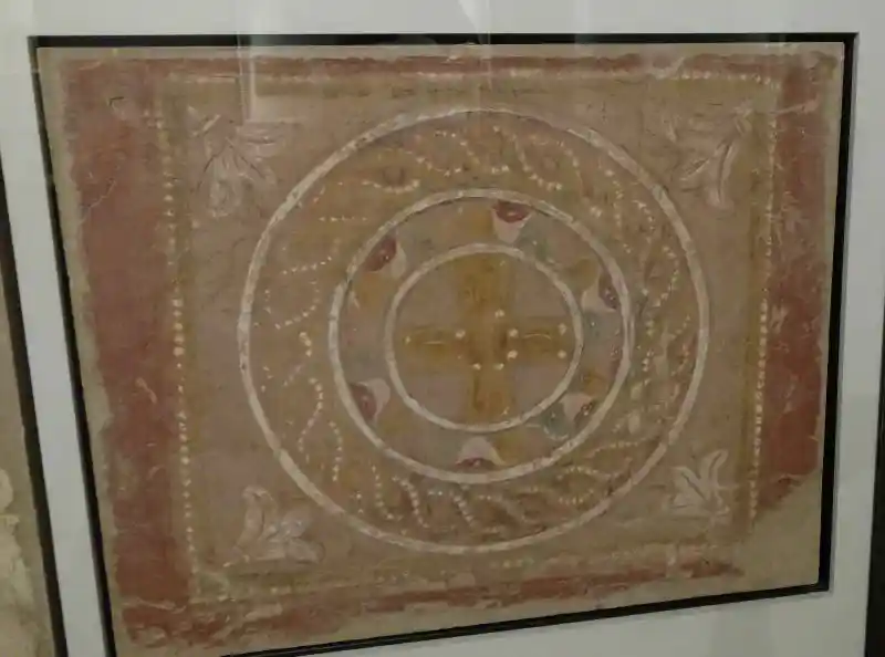 Mural, cross inside solar disc, sun symbol